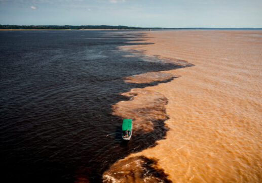 aerial image of the meeting of the Rio Negro and Solimões waters in the Amazon Manaus Brazil
