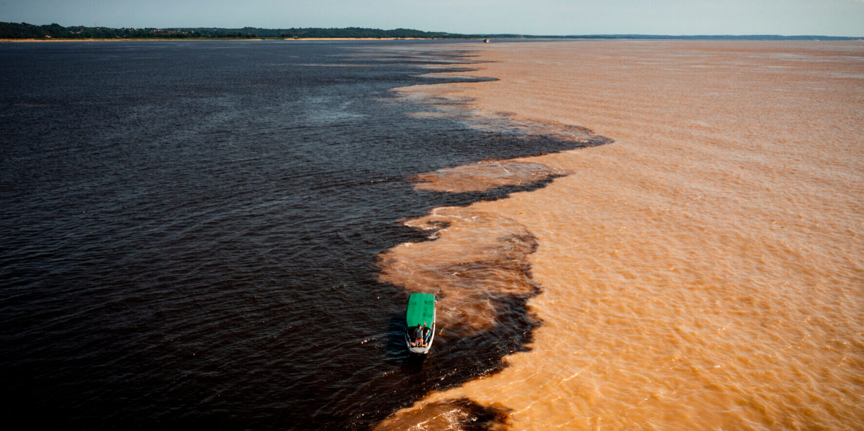 aerial image of the meeting of the Rio Negro and Solimões waters in the Amazon Manaus Brazil